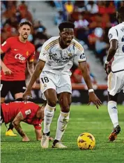  ?? Francisco Ubilla/Associated Press ?? Real Madrid’s Aurelien Tchouameni, centre, reacts during a Spanish La Liga soccer match against Mallorca Saturday in Palma de Mallorca, Spain.