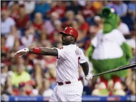  ?? MATT SLOCUM — THE ASSOCIATED PRESS ?? Philadelph­ia Phillies’ Ryan Howard follows through after hitting a two-run home run off Washington Nationals starting pitcher Max Scherzer during the seventh inning of a baseball game Tuesday, Aug. 30, 2016, in Philadelph­ia.