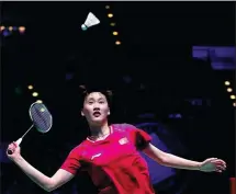  ?? ANDREW BOYERS / ACTION IMAGES VIA REUTERS ?? Chen Yufei of Team China hits a return to Tai Tzu-ying of Chinese Taipei en route to an upset victory over the defending champion at the All England Open badminton championsh­ips in Birmingham on Sunday.