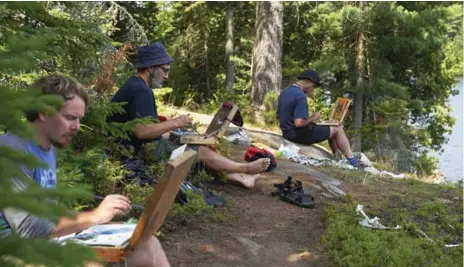  ?? MURRAY WHYTE/TORONTO STAR ?? Jon Houghton, left, David Marshuk and Peter Taylor paint the scene spread out before them along the shore of Blueberry Island in Algonquin Park.