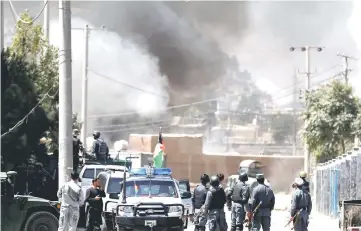  ??  ?? Smoke rises from the site of an attack in Kabul, Afghanista­n. — Reuters photo