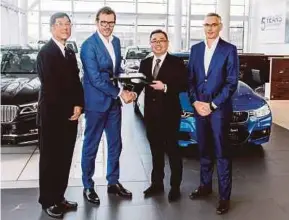  ??  ?? BMW Malaysia managing director and chief executive officer Harald Hoelzl (second from left) with Regas Premium Sabah dealer principal and managing director Matthew Tan (second from right) and other officials in Kota Kinabalu on Saturday.