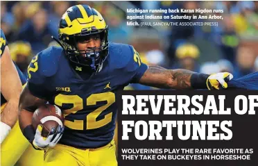  ?? [PAUL SANCYA/THE ASSOCIATED PRESS] ?? Michigan running back Karan Higdon runs against Indiana on Saturday in Ann Arbor, Mich.