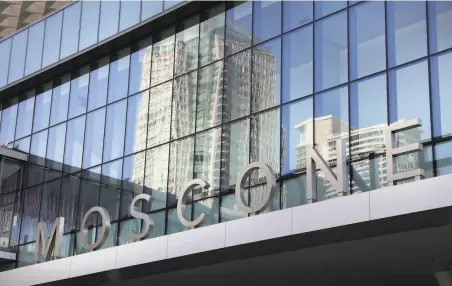  ?? Liz Hafalia / The Chronicle ?? Thomas Swan signs are all over San Francisco. The large letters adorning the Moscone Center are among the firm’s handiwork.