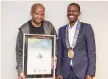  ?? | Supplied ?? IT PERSONALIT­Y of the Year Tiyani Nghonyama with IITPSA president Thabo Mashegoane.