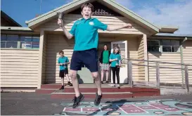  ??  ?? April: School is back and so is the bell at Lardner District Primary School. Student Troy Griffin leapt with joy at its return after the old bell had been stolen.