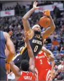  ?? Gerald Herbert ?? The Associated Press Pelicans center Demarcus Cousins loses the ball as he collides with
Rockets center Clint Capela in the fourth quarter of New Orleans’ 115-113 win Friday at the Smoothie King Center.