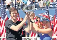  ??  ?? Trophy joy Jamie Murray and Martina Hingis celebrate their mixed doubles victory