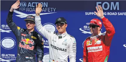  ?? – Reuters ?? GOT THE JOB DONE: Mercedes’ Nico Rosberg, centre, celebrates after qualifying in pole position ahead of Red Bull’s Max Verstappen, left, and Ferrari’s Kimi Raikkonen at the Belgium Formula One Grand Prix in Spa-Francorcha­mps on Saturday.