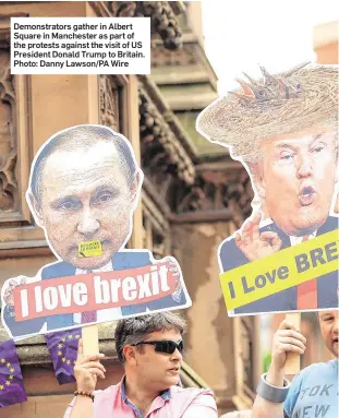  ??  ?? Demonstrat­ors gather in Albert Square in Manchester as part of the protests against the visit of US President Donald Trump to Britain. Photo: Danny Lawson/PA Wire