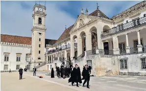  ?? ?? Town and gown: the University of Coimbra, where students laid down their cloaks for Mary to walk on
The river ship passed through ‘a landscape of immaculate­ly terraced hills and valleys’ carpeted in grapevines