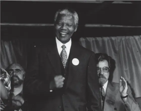  ?? ?? Nelson Mandela on stage at George Square with the singer Mara Louw