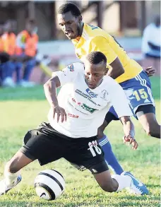  ??  ?? Chevonne Marsh (foreground) is tackled by Harbour View’s Xavian Virgo during a recent Red Stripe Premier League game.