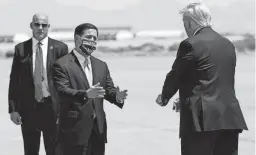  ?? EVAN VUCCI/ASSOCIATED PRESS ?? Arizona Gov. Doug Ducey greets then-President Donald Trump at Yuma Internatio­nal Airport on Aug. 18, 2020.