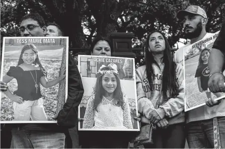  ?? Sam Owens/staff file photo ?? Jerry Mata, from left, Gloria Cazares, Kimberly Mata-rubio and Felix Rubio hold up pictures of the children they lost in the May 24 mass shooting at Uvalde’s Robb Elementary School while they attend a Marcha de los Niños event in Austin last month.