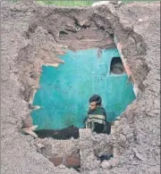  ?? PTI ?? A villager stands inside his damaged house after heavy shelling from the Pakistani side at Mendhar, Poonch, on Friday.