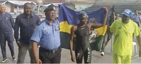  ?? ?? Rivers State Commission­er of Police Tunji Disu ( left); Gold medal winner from the Nigerian Police Swimming, Oluchi Obi and Chairman Swimming, Nigeria Police Force, ACP Shuabu Bello during the 11th Chief of Naval Staff National Swimming Championsh­ip in Part Harcourt… yesterday.