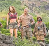  ?? NIKO TAVERNISE ?? Johnson, center, stars in “Jumanji: Welcome to the Jungle” with Nick Jonas, Karen Gillan, Kevin Hart and Jack Black. It’s in theaters now.