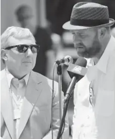  ?? CHIP EAST/REUTERS ?? I’ll Have Another trainer Doug O’Neill is consoled by his team in shed row before he made the announceme­nt, right, that the horse would not run in the Belmont Stakes.