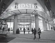  ?? [PHOTO BY BEN NELMS, BLOOMBERG] ?? Pedestrian­s walk past a Nordstrom store in downtown Vancouver, British Columbia.