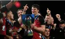  ?? Photograph: Hannah Peters/Getty Images ?? Scott Barrett holds the Super Rugby trophy after Crusaders won last year’s final.
