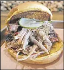  ?? TWIN SMOKERS BBQ
CONTRIBUTE­D BY ?? Twin Smokers BBQ serves oakand hickory-smoked Southernst­yle pulled pork.