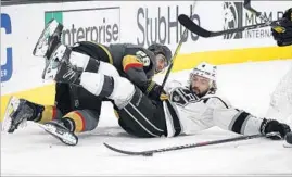  ?? John Locher Associated Press ?? DEFENSEMAN DREW DOUGHTY of the Kings, right, and right wing Alex Tuch of the Vegas Golden Knights crash to the ice in the second period.