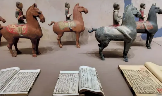  ??  ?? Showcases include pottery saddle horses from the Tang Dynasty (AD 618-907) which were excavated in Xi’an in Shaanxi Province.
The figurines show Western appearance­s, proving the exchanges between the East and the West along the Silk Road. The documents about Swedish geographer Sven Hedin and Chinese scientist Xu Bingxu are on display, showing their contributi­ons to the academic study of the Silk Road. The exhibition will go through August 23. — All photos by courtesy of the China National Silk Museum