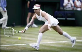  ?? JOHN WALTON — PA VIA AP ?? Bethanie Mattek-Sands in action in a women’s doubles match with Lucie Safarova against Kaia Kanepi and Andrea Petkovic on the fourth day of the Wimbledon Tennis Championsh­ips in London, Thursday.
