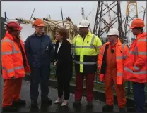  ??  ?? First Minister Nicola Sturgeon chats to workers at a viewing platform during a visit to Burntislan­d Fabricatio­ns Ltd in Methil