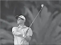  ?? Associated Press ?? Adam Scott hits from the 16th tee during the second round of the Cadillac Championsh­ip golf tournament Friday in Doral, Fla.