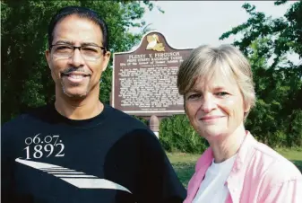  ?? Bill Haber / Associated Press 2011 ?? Keith Plessy and Phoebe Ferguson, descendant­s of the principals in the Plessy vs. Ferguson Supreme Court ruling, stand in front of a plaque in New Orleans marking the case in 2011.