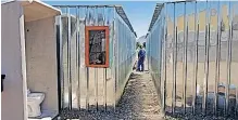  ?? | IAN LANDSBERG African News Agency (ANA) ?? DWELLERS at the Royal Road informal settlement are unhappy about the tiny metal structures the City of Cape Town is now erecting for them. They claim that is not what they were promised initially.