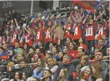  ?? JAMES HILL THE NEW YORK TIMES ?? Fans look on as Russia’s hockey team takes on Belarus on Jan. 30 in Moscow. Last-minute legal maneuverin­g by Russia could open the way for more of its athletes to compete in the Winter Olympics despite efforts to bar the country entirely from the Games...