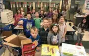  ?? PHOTO PROVIDED ?? Students at West Sand Lake Elementary pose for a photo as they create care packages for members of the military.