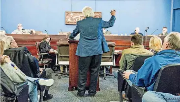  ??  ?? Richard Morrissett­e speaks against proposed zoning changes along Fox Lake Lane.