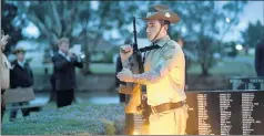  ?? Picture: PAUL CARRACHER ?? LESSONS OF WAR: Johnathan Spence stands to attention at Horsham’s Anzac Day dawn service yesterday.