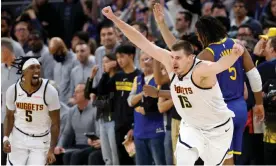  ?? Photograph: John G Mabanglo/EPA ?? Denver Nuggets center Nikola Jokić celebrates after hitting the game-winning three-pointer against the Golden State Warriors on Thursday night.