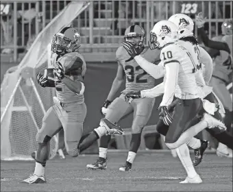  ?? STEW MILNE/AP PHOTO ?? UConn running back Arkeel Newsome, left, runs for a 90-yard touchdown as East Carolina defensive back Rocco Scarfone (10) and defensive back Domonique Lennon, right, pursue during the third quarter of the Huskies’ 31-13 victory on Friday night.