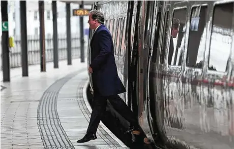 ??  ?? Britain’s Prime Minister David Cameron arrives for a regional cabinet meeting in Leeds in northern England, an area which is likely to be opposed to the high- speed trainline.