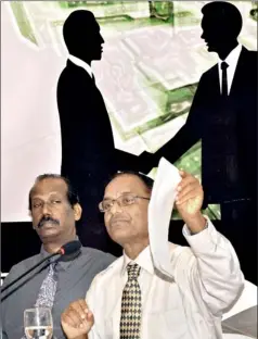  ??  ?? Jayampathy Wickramara­tne,PC,waves a copy of the 2000 draft constituti­on, seated next to law academic V.Thamilmara­n,during a discussion on the impeachmen­t in Colombo.(Above) pix of the President, Speaker, Chief Justice and members of the Select...