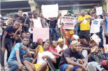  ??  ?? Thousands of #EndSARS protesters yesterday paralyzed commercial activities in further demonstrat­ion against police brutality in Nigeria
