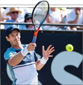  ?? ?? BACK IN THE MIX: Murray strikes a forehand on his way to victory yesterday