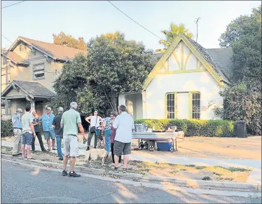  ?? COURTESY OF DIANE STEMBER RICHARDS ?? Willow Glen residents attended a “Rest in Peace” get-together last week to say goodbye to this old house at 924 Willow Glen Way. It will be torn down in a few weeks because the foundation is shot and was deemed irreparabl­e.