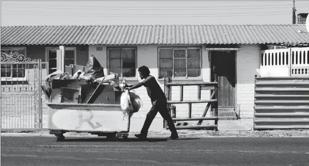  ?? PHOTO: HENK KRUGER/AFRICAN NEWS AGENCY (ANA) ?? A man pushes a trolley with recycled wood, plastic and metal along Bluegum Street in Bonteheuwe­l. Plastic recycling makes a lot of sense, says the author.