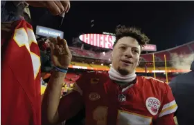  ?? ED ZURGA — THE ASSOCIATED PRESS ?? Chiefs quarterbac­k Patrick Mahomes greets fans after a wild-card playoff football game against the Dolphins on Saturday in Kansas City, Mo.