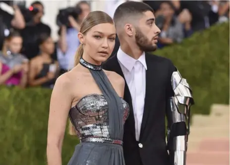  ?? DIMITRIOS KAMBOURIS/GETTY IMAGES ?? Gigi Hadid, who is half-Palestinia­n, and Zayn Malik, whose father is British-Pakistani, are at the centre of a crucial moment.