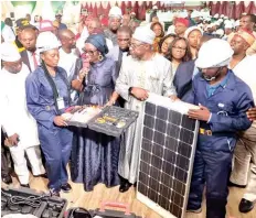  ?? ?? Senator Kola Balogun ( left); one of the trainees, Dilibe Chinaza Priscillia; Chairman Senate Committee on Science, Technology and Innovation, Senator Uche Ekwunife and the Executive Vice Chairman, Chief Executive, National Agency for Science and Engineerin­g Infrastruc­ture ( NASENI), Prof. Mohammed Sani Haruna, at the training on solar installati­on and maintenanc­e organised for youths by NASENI in Awka, Anambra State