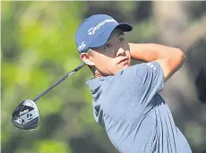  ?? — AFP photo ?? Morikawa plays his shot from the 11th tee during the final round of the Masters Tournament at Augusta National Golf Club in Augusta, Georgia.