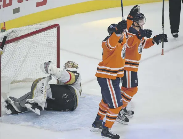  ?? ED KAISER ?? Edmonton Oilers Matthew Benning and Patrick Maroon celebrate Benning’s goal against Vegas Golden Knights netminder Maxime Lagace Tuesday during the Oilers’ 8-2 romp at Rogers Place. It was Edmonton’s fourth win in 10 games at its home rink.